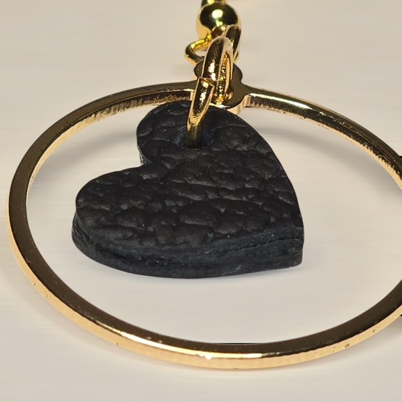 Gold and Black Hoop Earrings with Heart Pendants - Picture 2 of 2